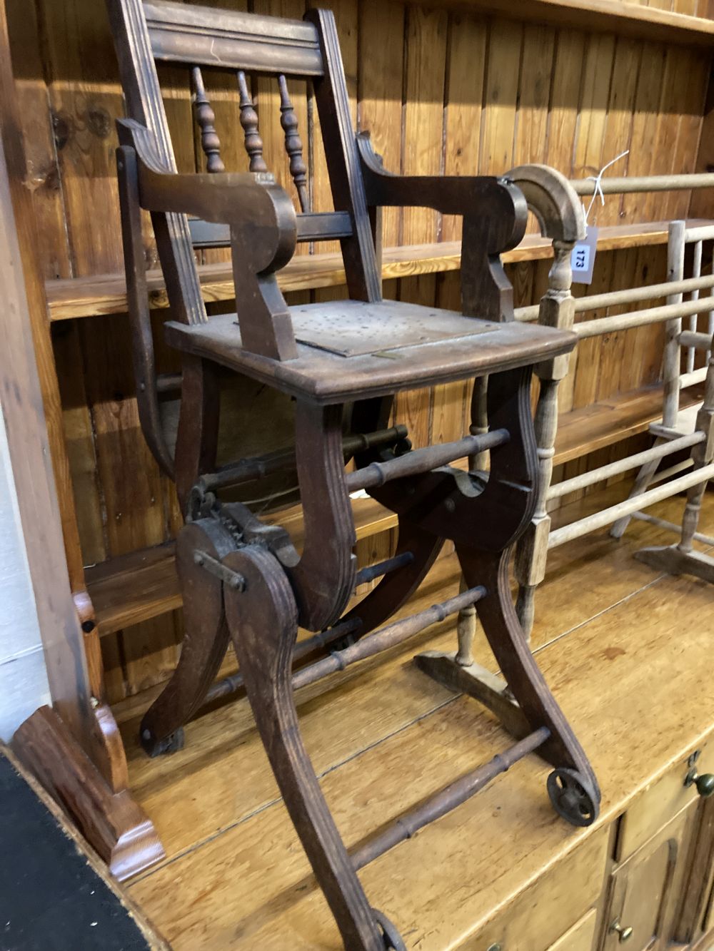 A Victorian towel rail, a primitive childs elbow chair and a metamorphic chair